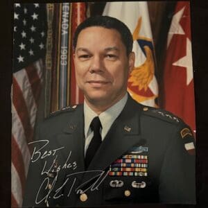 Military officer in uniform with flags background.