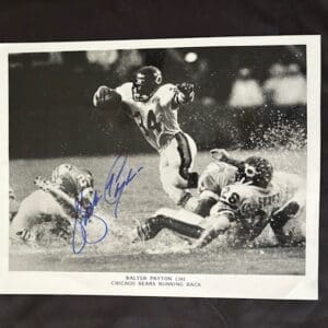 Football player evading tackles during a game.