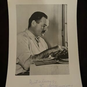 Man typing on a typewriter, vintage photograph.