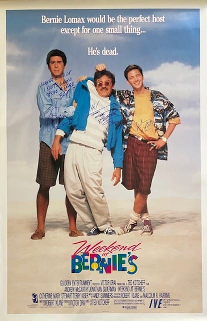 Three men in tropical-themed movie poster.