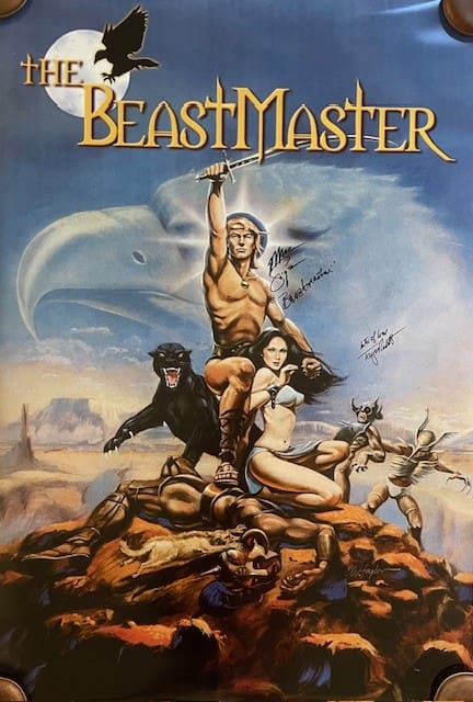 Fantasy movie poster with heroic figures.