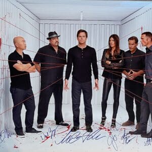 Group in blood-splattered room with red strings.