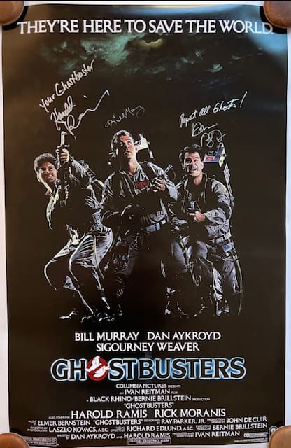 Ghostbusters movie poster with signed autographs.