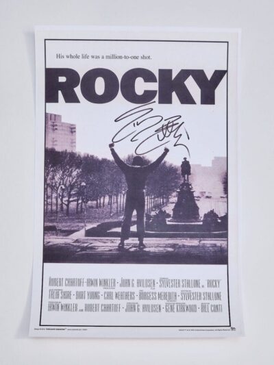 Signed Rocky movie poster with iconic scene.