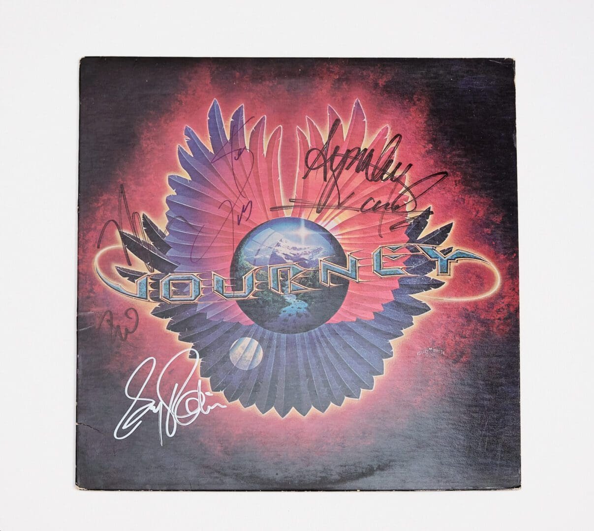Signed Journey album cover with celestial design.