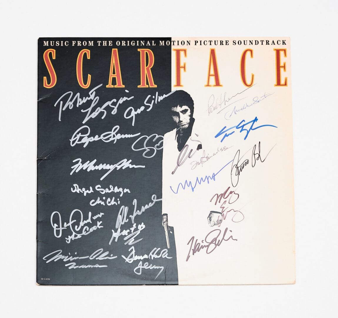Scarface soundtrack cover with multiple autographs.