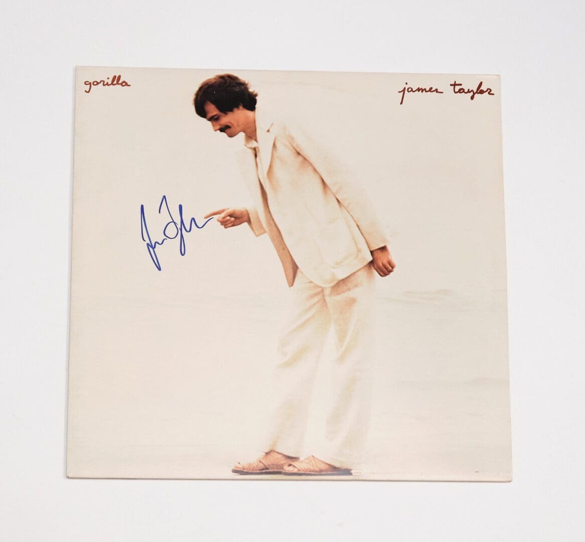 Album cover with man in white suit.