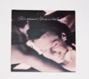Album cover with smiling person.