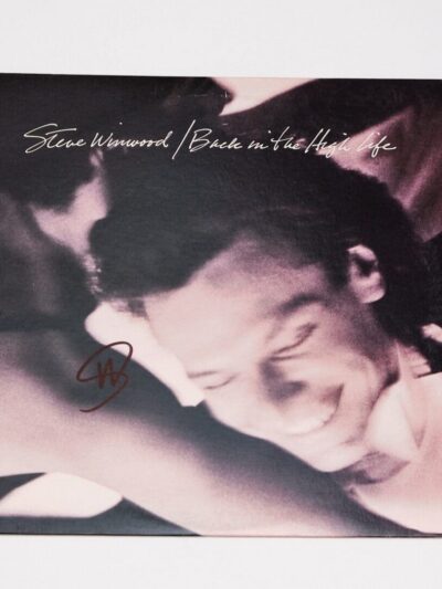 Album cover with smiling person.