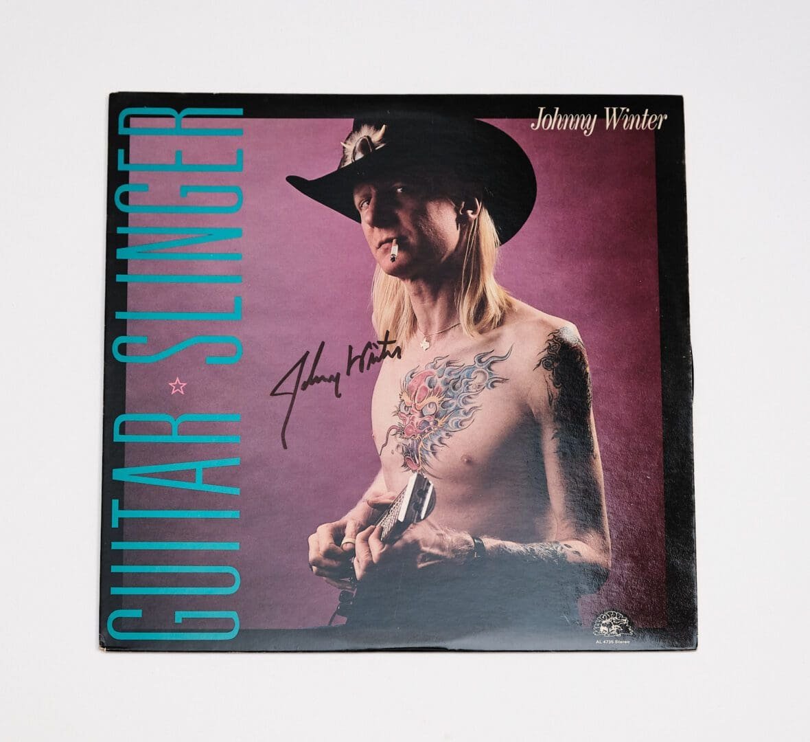 Album cover featuring a tattooed musician.