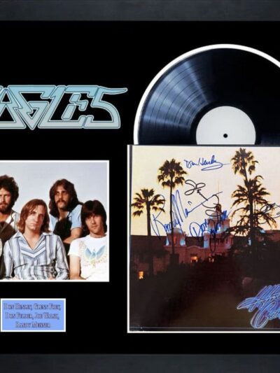 Eagles memorabilia with band photo and vinyl.