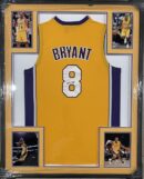 Framed Lakers jersey with action photos.