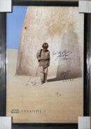Child standing in desert with shadow.