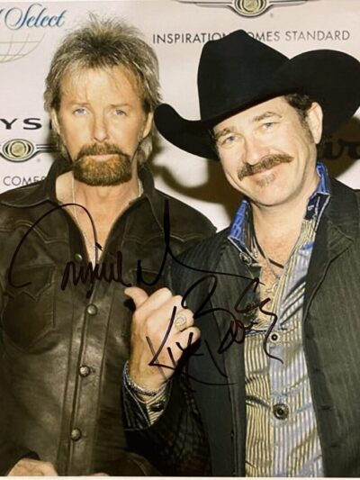 Two men posing at an event.