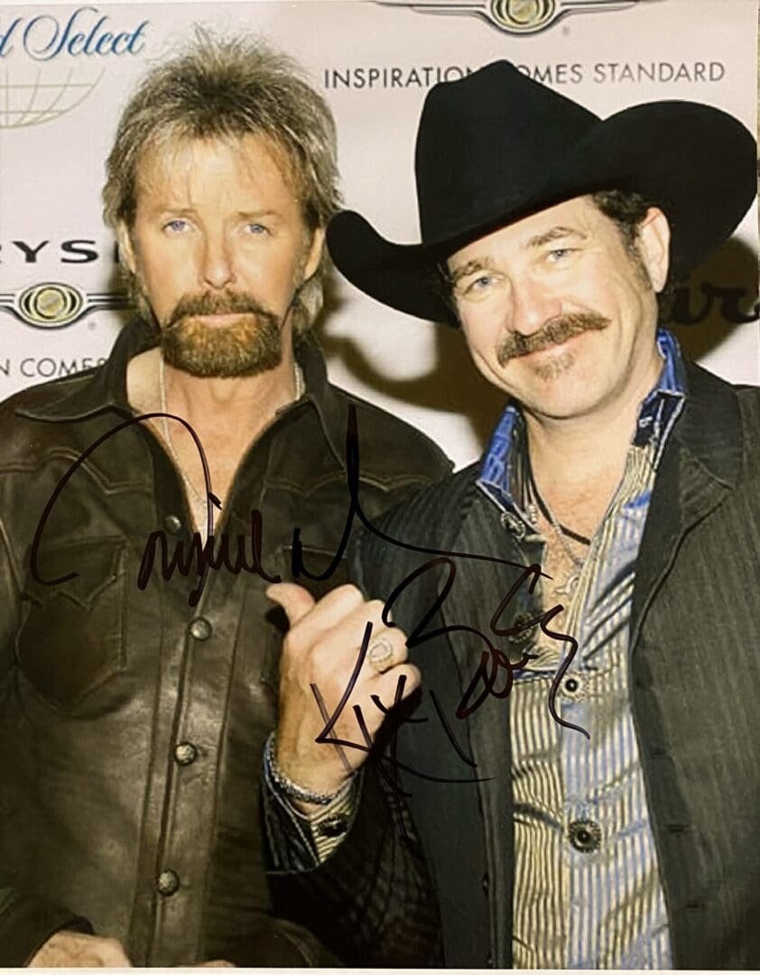 Two men posing at an event.