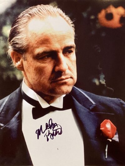 Man in tuxedo with red rose