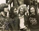 Four men standing together
