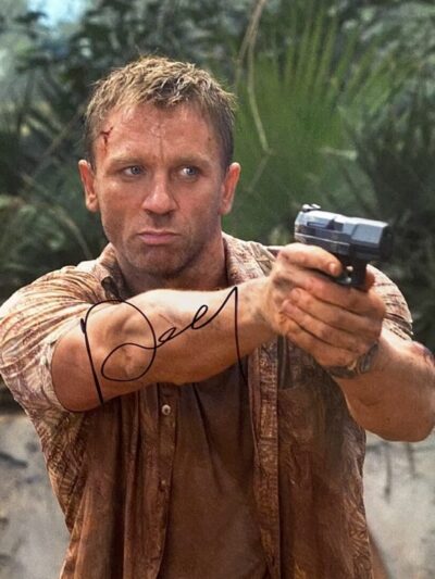 Man aiming gun in outdoor setting.