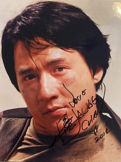 Signed portrait of a serious-looking man.