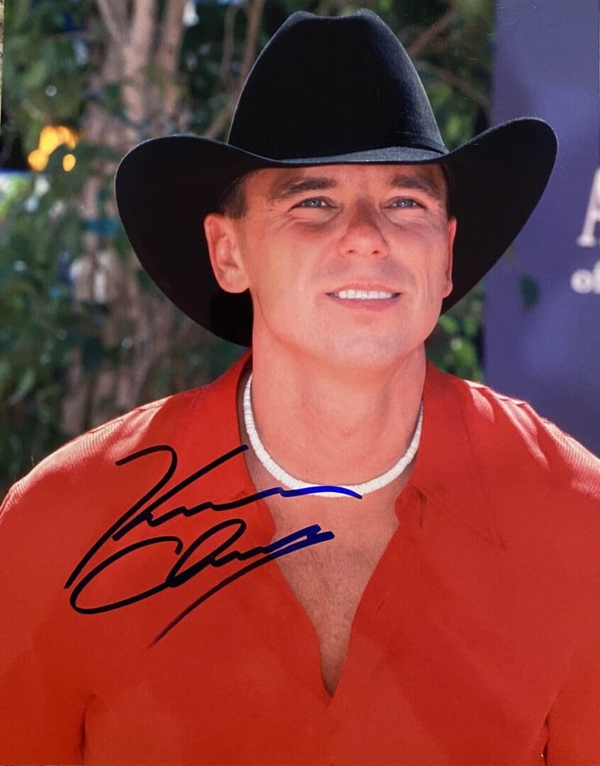 Man in cowboy hat and red shirt.