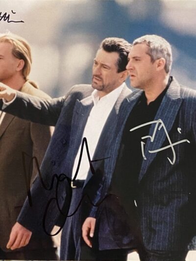 Three men walking in suits