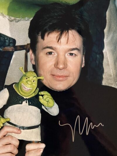 Man holding a Shrek toy figure