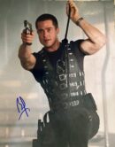 Man in tactical gear aiming a gun.