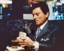 Man counting money in a suit.