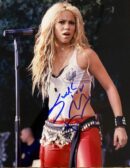 Singer performing on stage with microphone.