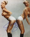 Two women posing in white underwear.