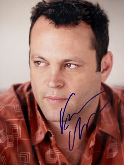 Man in patterned shirt with autograph.