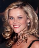 Smiling woman with wavy blonde hair.
