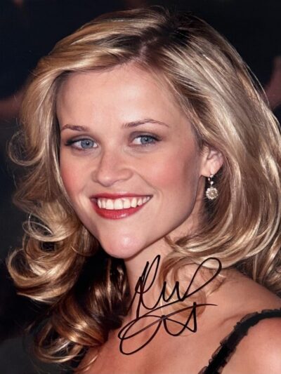 Smiling woman with wavy blonde hair.