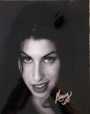 Woman with dark hair and piercing gaze.