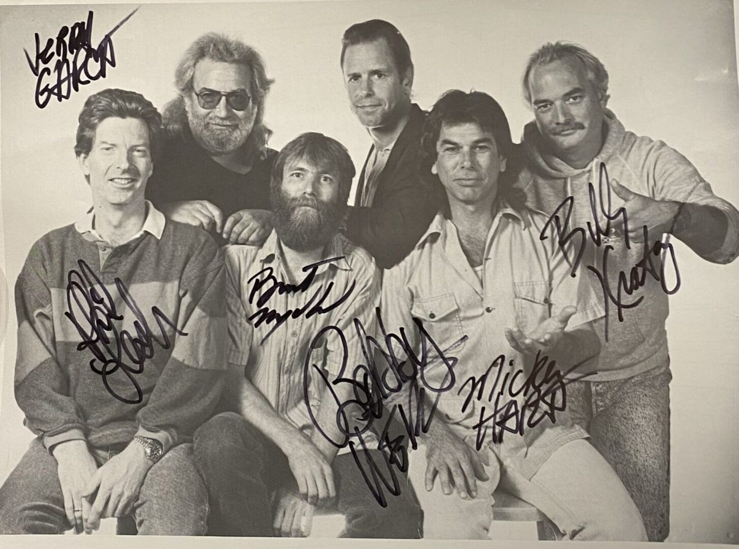Group of six men with autographs.