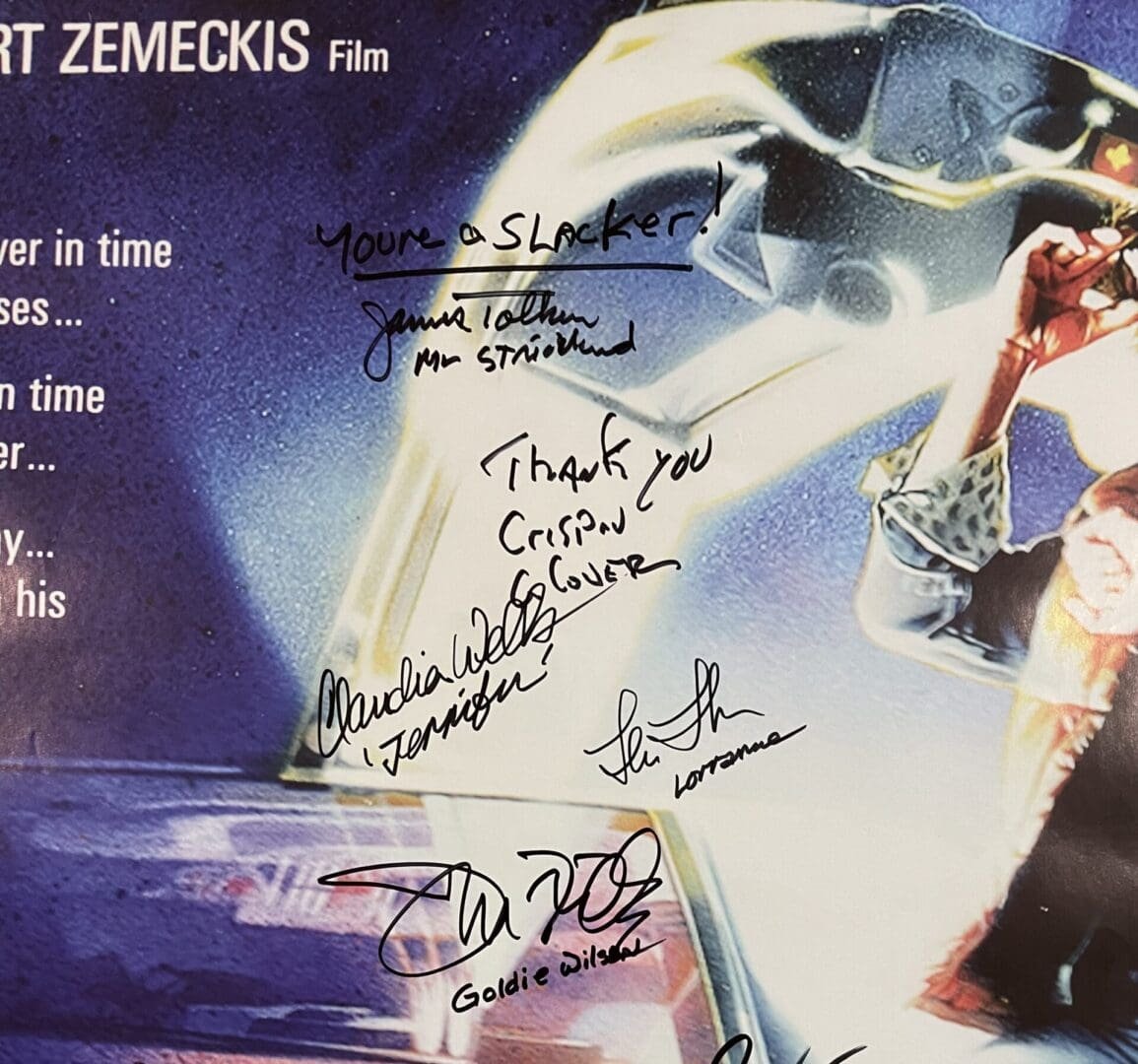Autographed movie poster with handwritten signatures.