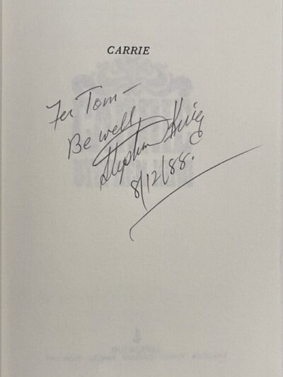 Signed book inscription with handwritten note.