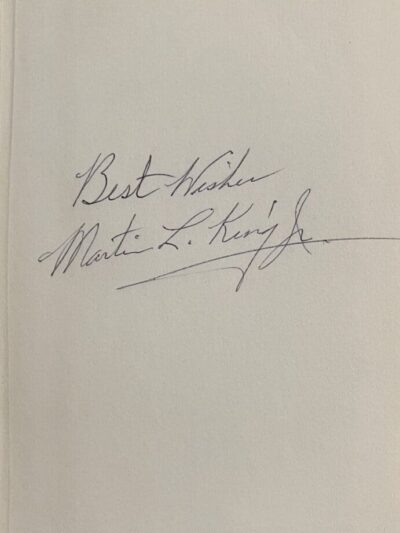 Handwritten note with a signature.