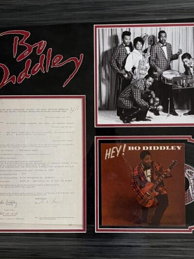 Bo Diddley album cover and memorabilia display.