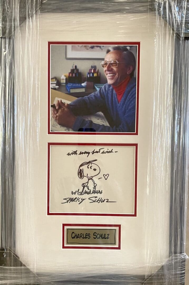 Framed photo and drawing with signature.