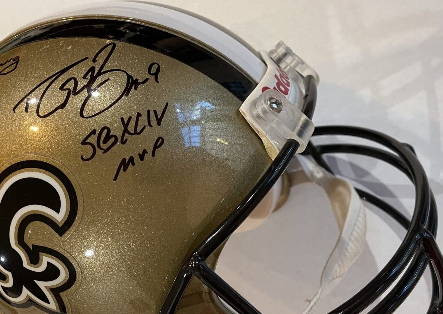 Autographed football helmet with MVP inscription.