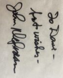 Handwritten note with a signature in black.