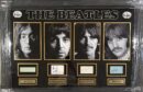The Beatles portraits with signatures display.