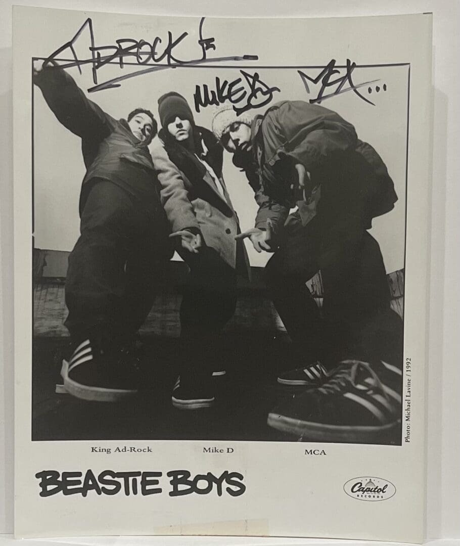 Three men posing in a black-and-white photo.