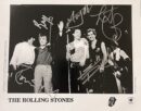 Black-and-white band photo with signatures.