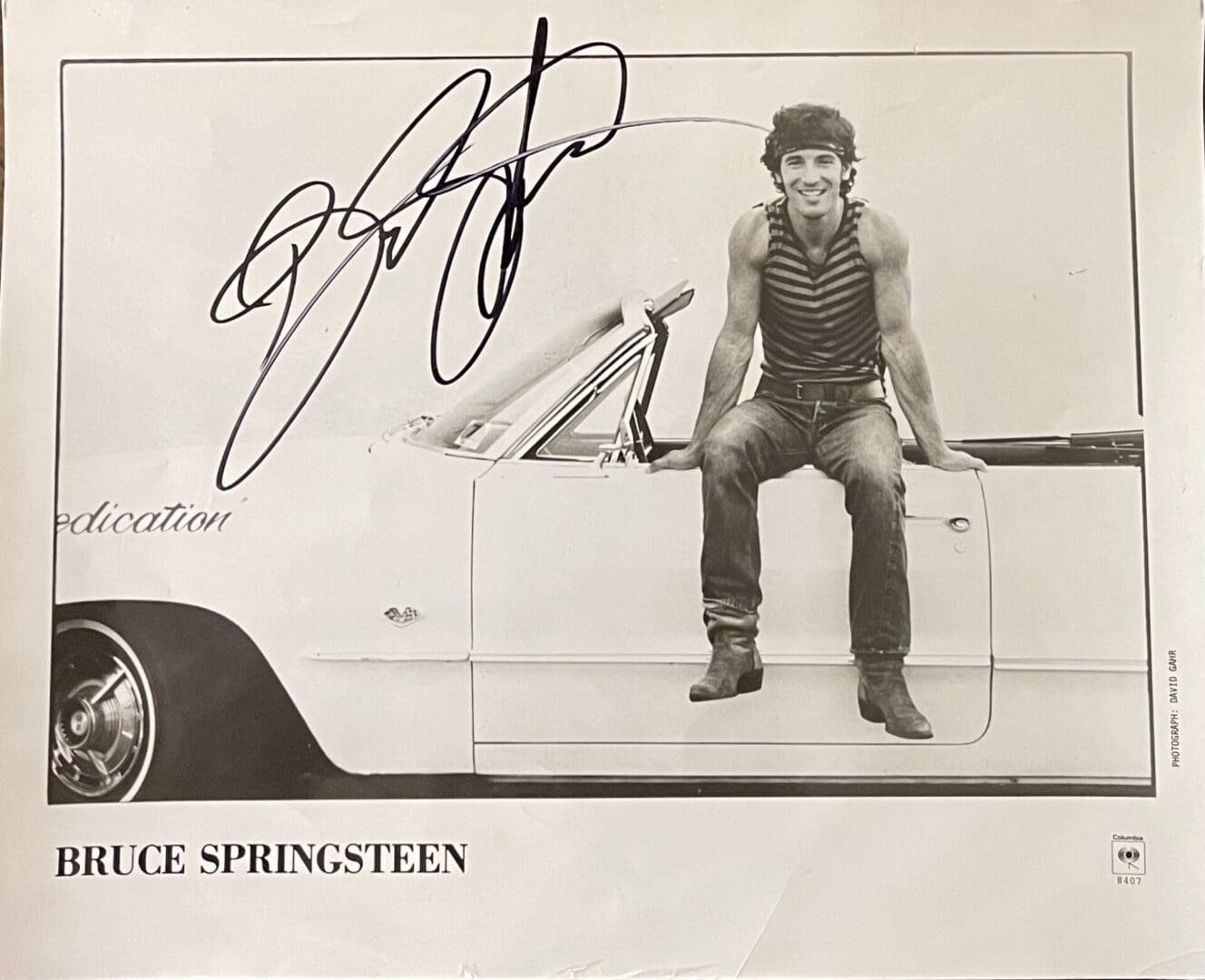 Man sitting on car