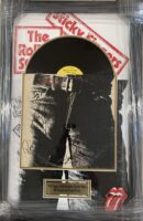 Framed Rolling Stones album with signatures displayed.