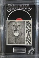 Signed Santana album cover display.