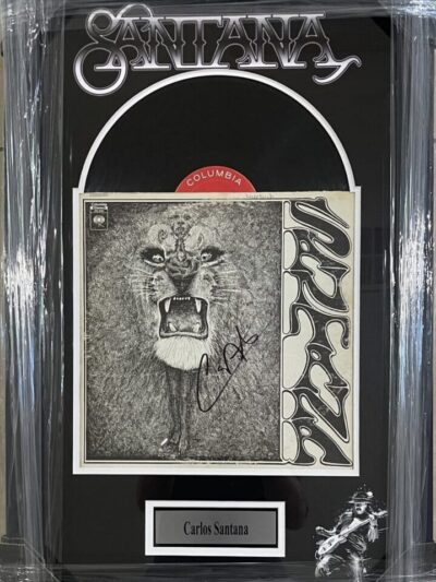 Signed Santana album cover display.