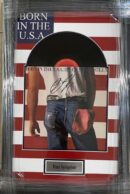 Signed album with American flag background.